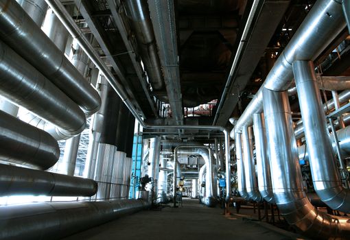 Equipment, cables and piping as found inside of  industrial power plant