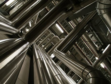 Equipment, cables and piping as found inside of  industrial power plant