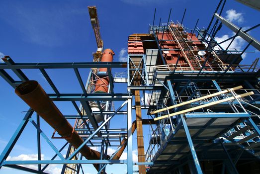 cranes and beams on construction of industrial factory        
