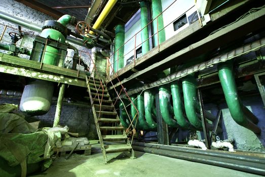 Equipment, cables and piping as found inside of  industrial power plant