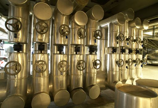 Equipment, cables and piping as found inside of a modern industrial power plant