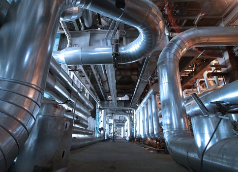 Equipment, cables and piping as found inside of  industrial power plant