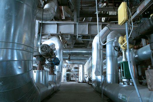 Equipment, cables and piping as found inside of  industrial power plant