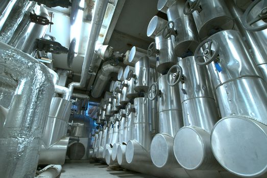 Equipment, cables and piping as found inside of  industrial power plant