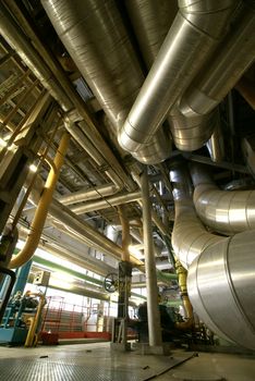 Equipment, cables and piping as found inside of  industrial power plant