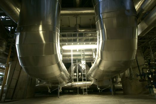 Equipment, cables and piping as found inside of  industrial power plant