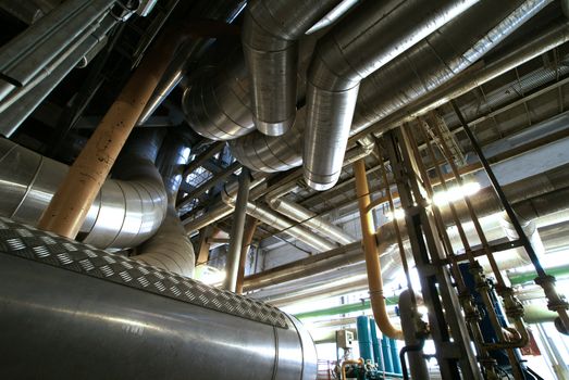 different size and shaped pipes and valves at a power plant 