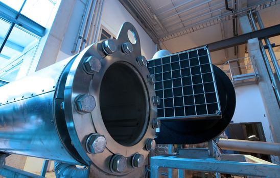 Equipment, cables and piping as found inside of  industrial power plant