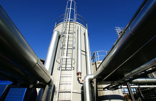 Equipment, cables and piping as found inside of  industrial power plant