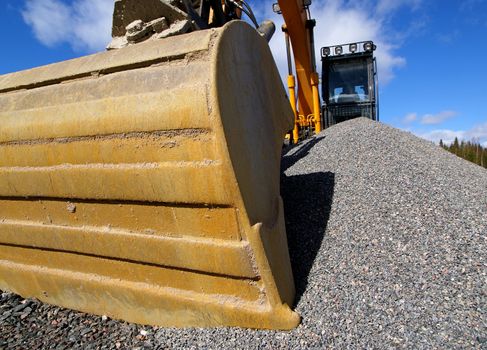 excavator against blue sky    
