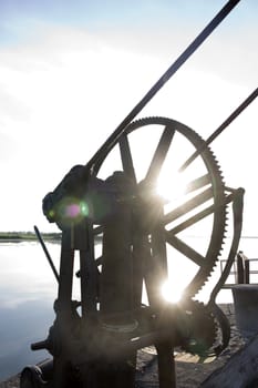 old mechanical crane gears on the pier at Salleen in Ballylongford county Kerry Ireland