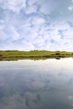 view of the Shannon estuary and fields from Salleen pier on a bright cloudy day