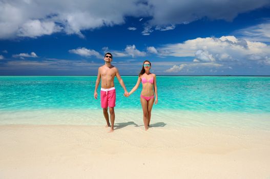 Couple on a tropical beach at Maldives