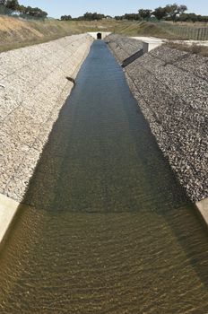 Water diversion canal upstream the Alvito reservoir near Oriola village, part of the Alqueva Irrigation Plan, Alentejo, Portugal