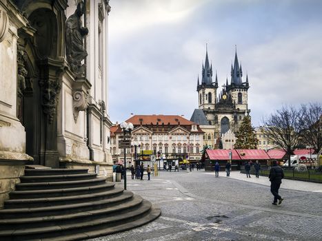 View to entrance of St Nicholas cathedral and view to Tyn chathedral in Prague Europe on a cloudy day