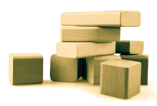 Wooden building blocks isolated on white background.