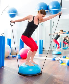 Bosu ball for fitness instructor woman in aerobics gym