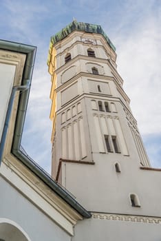 Steeple of the church in the town of Dachau in Germany with evening sun