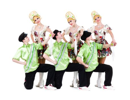 Dancer team wearing a folk ukrainian costumes dancing.  Isolated on white background in full length.