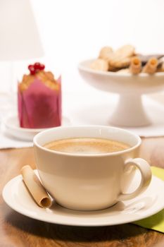 Coffee with muffin and cup of cookies