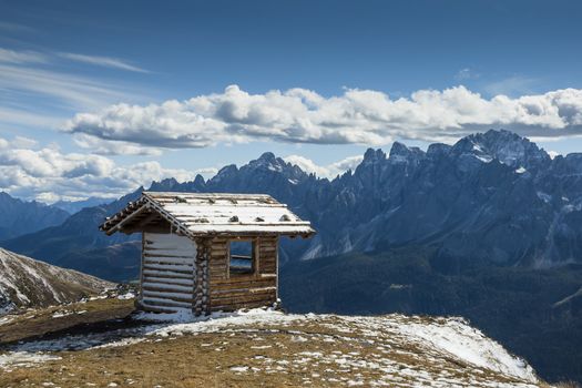 Refuge in the high mountains in South Tyrol on a sunny day with clouds
