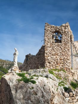 Old Church Bell and Jesus Statue in Mijas, Spain, Costa Del Sol