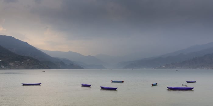 Boats on Phewa lake in Pokhara, Nepal