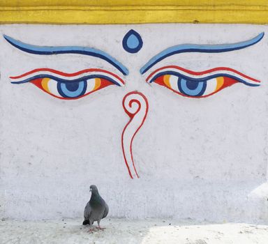 Buddha eyes painted on a white wall in Kathmandu, Nepal