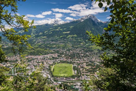 View to Merano in South Tirol on a sunny day with blue sky and white clouds