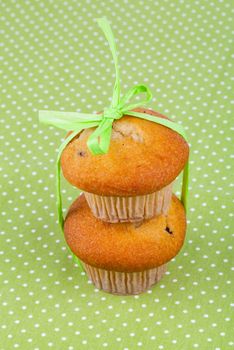 two muffins, on green background