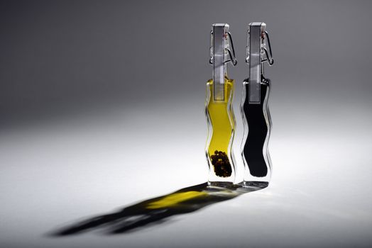 Two bottles of vinegar and oil