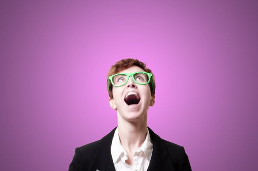 screaming business woman with green eyeglasses on pink background