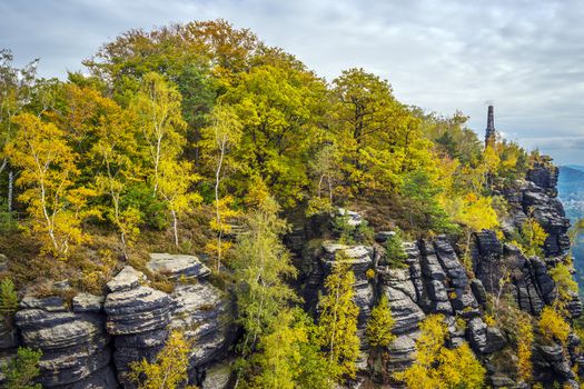 Lilienstein in Saxony Switzerland with memorial and colorful trees in autumn on a sunny day