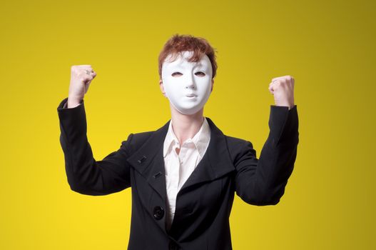 strong business woman with white mask on yellow background