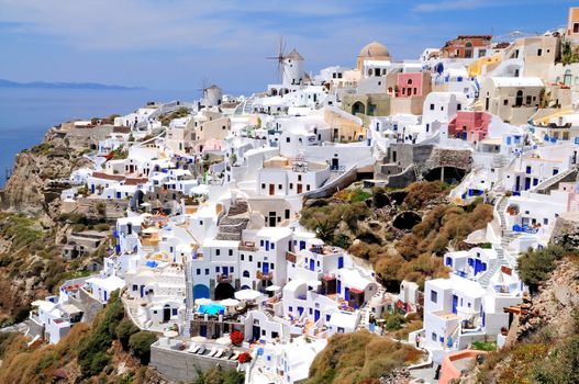 Windmile and houses of Oia on Santorin island