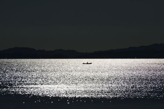 Eveningmood at Chiemsee with small boat