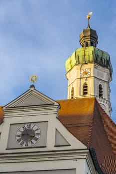 Steeple of the church in the town of Dachau in Germany with evening sun