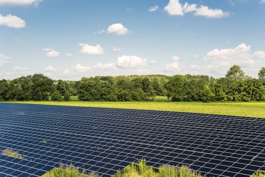 Solar Panel field in Bavaria Germany with blue sky and clouds