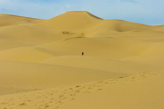 Sand dune in Mongolia desert with one person