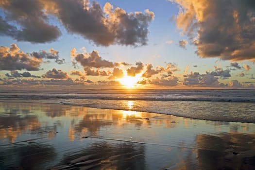 Golden sunset at the north sea coast in the Netherlands