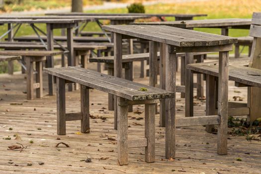 Lonely wooden bench in a German beer garden in autumn