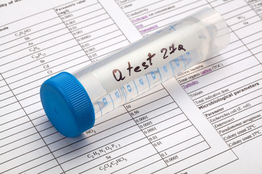 Drinking water in the test tube for chemical and microbiological analysis