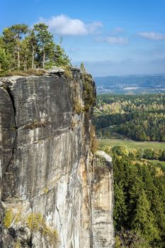 Scenery in Saxony Switzerland on a sunny day with blue sky and white clouds in autumn.