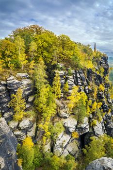 Lilienstein in Saxony Switzerland with memorial and colorful trees in autumn on a sunny day