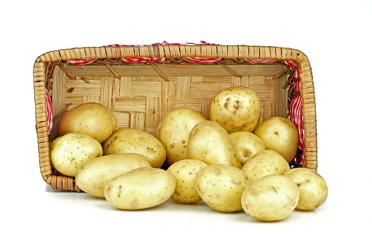 New potatoes falling out of a basket