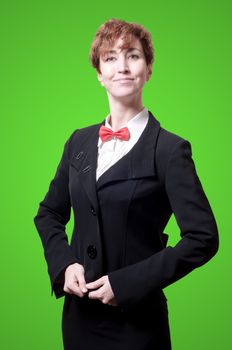 elegant businesswoman with bow tie on green background