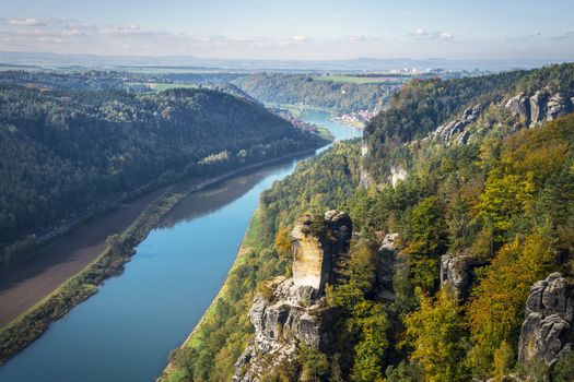 View from viewpoint of Bastei in Saxon Switzerland Germany to the town Wehlen and the river Elbe on a sunny day in autumn