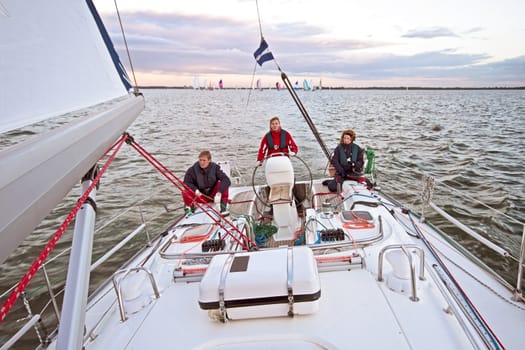 Sailing on the IJsselmeer in the Netherlands at sunset