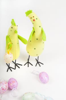 Easter chicken family with eggs on light background