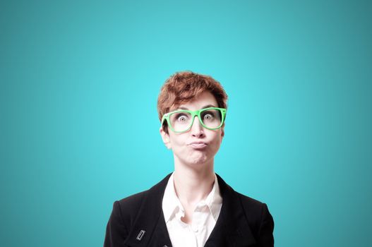 funny business woman with green eyeglasses on blue background